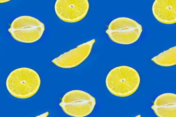 Fresh lemon seamless pattern on a bright blue color background. Top view, flat lay, design element.