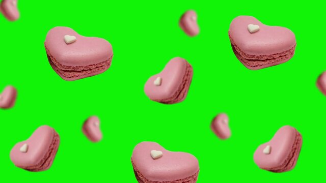 Sweet macaroons in pink heart shape flying and wiggle on  isolated background.  French Macarons cookie is a sweet meringue-based confection. Valentines day, Date, Wedding, Love gift.Pastry shop card - Powered by Adobe