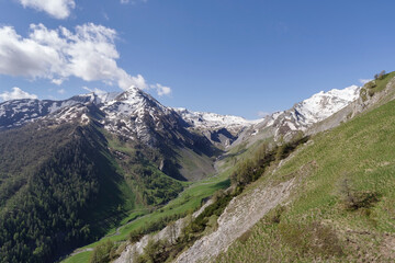 Fototapeta na wymiar Cottian Alps mountain range view above from Stura di Demonte Valley, Province of Cuneo, Italy