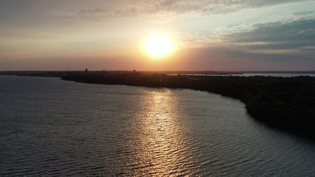 Sunset over Lake Monona in Madison Wisconsin - Downtown in Distance (Drone - Left to Right Higher)
