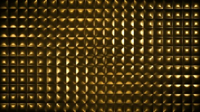Golden beautiful embossed 3D background. The pads are illuminated from different sides. Convex tiles made of glossy material. 4K. Embossing with square cells.