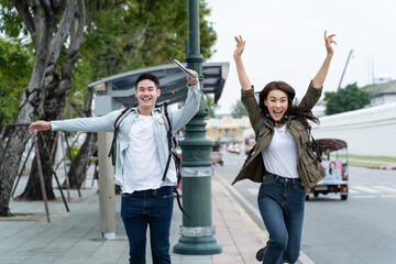 Asian attractive romantic couple travel in the city for honeymoon trip. 