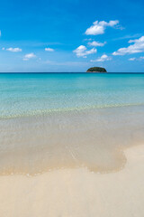 Kata beach in Phuket, Thailand, beach with clear water, white and golden sand, blue sky, in tropical vacation area.  a beach holiday  photo with copyspace.