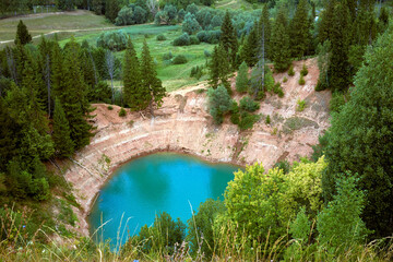 Beautiful karst lake Sea Eye in the Republic of Mari El, Russia. Unusual turquoise color of the...
