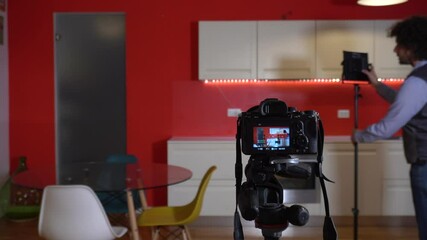 Photographer real estate - videos of interiors of houses for sale - home staging furniture and lighting arrangement to enhance the kitchen and living room - professional photographic service indoor 