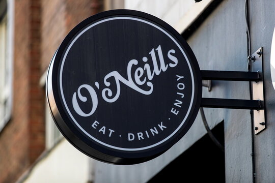 A logo is seen on signage outside an O'Neill's pub in London