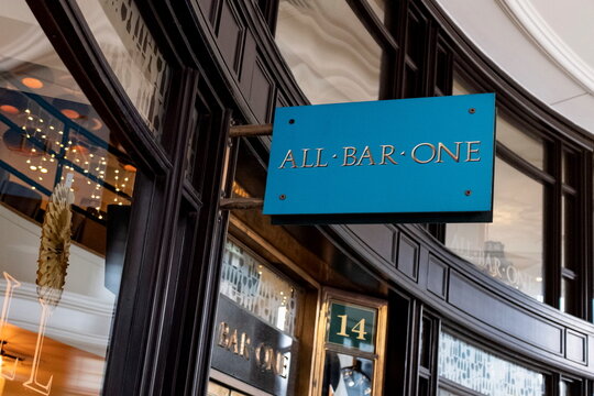 A logo is seen on signage outside a branch of All Bar One in London