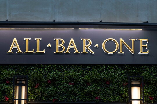 A logo is seen on signage outside a branch of All Bar One in London
