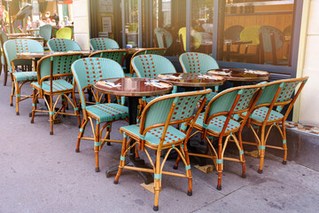 French restaurant - tables and chairs on the street - 480224474
