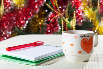 A mug of coffee with a love heart on the holiday background