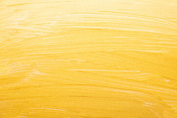 golden paint brush texture background close up