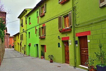 Fototapeta na wymiar cityscape of Ghizzano, a small colorful village in the municipality of Peccioli in Pisa, Tuscany, Italy