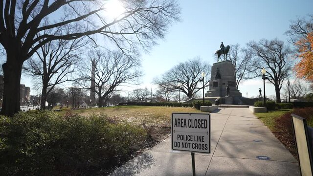 Washington, DC, USA - 12 26 2021: General William Tecumseh Sherman Statue in Presidents Park next to the White House, area closed, police line, do not cross.