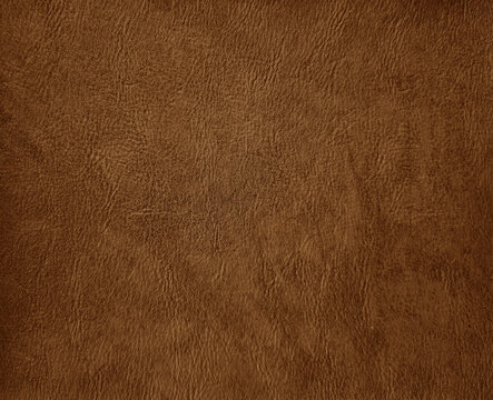 vintage brown faux leather. brown artificial leather background for luxury, elegant and classic concept. plain background of brown leather in close-up view.