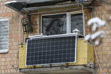 Winter view of the solar battery panel mounted on the balcony of an apartment building in Kyiv, Ukraine