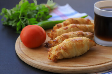 Turkish style potato pie in the form of a roll, made by wrapping dough.