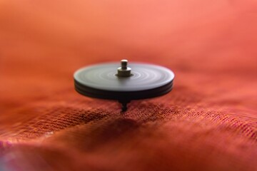 spinning top in red background
