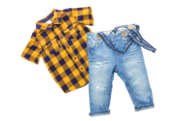 Fashionable blue jeans with braces or suspenders for child boy and a yellow blue checkered shirt...