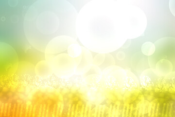 Abstract bright spring or summer landscape texture with natural green bokeh lights and yellow gold circular lights with sunshine and sun rays. Beautiful autumn background with copy space.