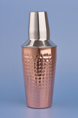 Cocktail shaker on blue background