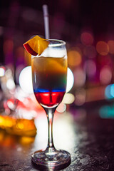 Tasty cocktail with alcohol in low key on a dark background.