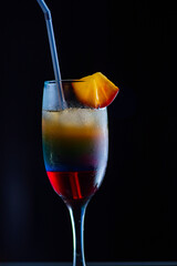 Tasty cocktail with alcohol in low key on a dark background.