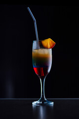 Tasty cocktail with alcohol in low key on a dark background.