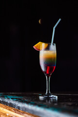 Tasty cocktail with alcohol in low key on a dark background.