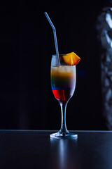 Tasty cocktail with alcohol in low key on a dark background.