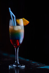 Tasty cocktail with alcohol in low key on a dark background.
