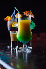 Tasty cocktail with alcohol in low key on a dark background.