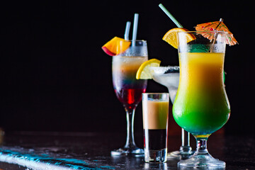 Tasty cocktail with alcohol in low key on a dark background.