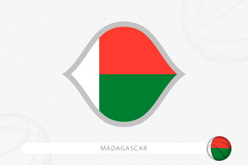 Madagascar flag for basketball competition on gray basketball background.