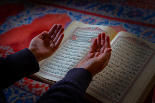 Praying muslim man. Muslim man praying by raising the hands