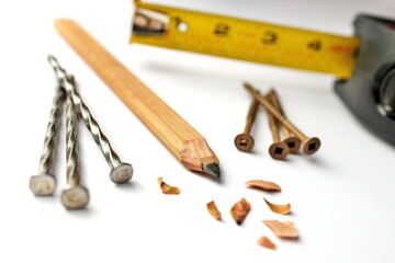 Carpenter's Pencil with Sharpening Shavings, Tape Measure, Framing Nails and Deck Screws