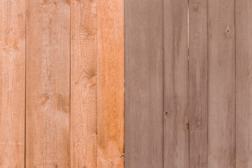 Brown paint on the surface of the boards of the old fence wooden texture plank background