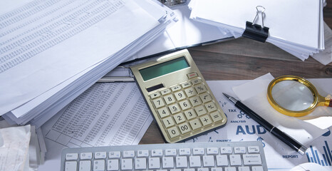 Fototapeta na wymiar Calculator, keyboard, pen, documents, magnifying glass. Business. Accounting