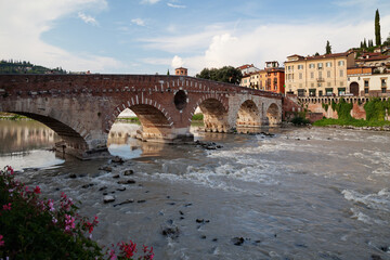 Verona, Italy. Adige river, Ponte Pietra bridge at sunset - 480243651