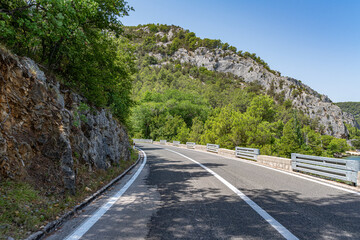 A road with sharp turns in the mountains. Serpentine highway.