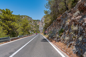 A road with sharp turns in the mountains. Serpentine highway.