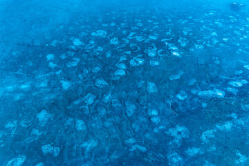 Fototapeta na wymiar Frozen Lake Surface Ice Cold Winter Blue Background Abstract Texture Pattern Season
