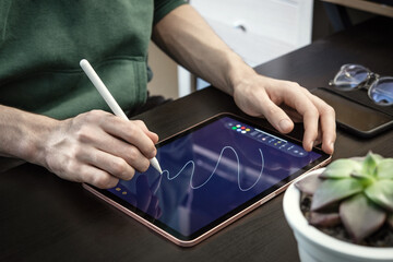 Man using digital tablet for drawing
