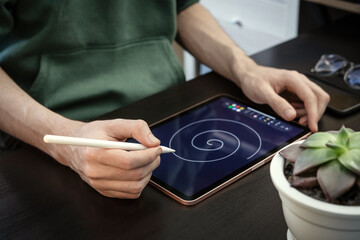 Man using digital tablet for drawing