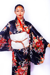 Fototapeta premium young pretty geisha in black kimono posing isolated on white background, asian ethno