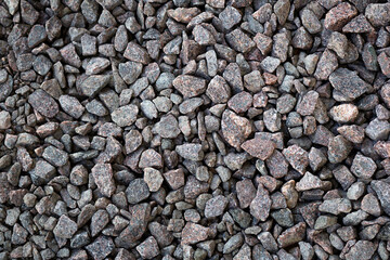 Granite rubble for the background, Broken stone. Building materials, crushed rock. Background for garden beds.