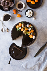 Hello February! Tasty homemade chocolate cake with decoration  on concrete  table, flat lay. Space for text