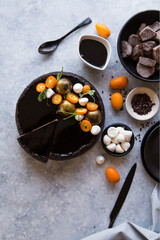 Hello February! Tasty homemade chocolate cake with decoration  on concrete  table, flat lay. Space for text