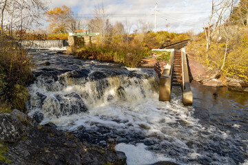 Fish ladder next to river waterfall