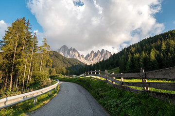 Beautiful St. Magdalena village with magical Dolomites mountains in a gorgeous Val di Funes valley, South Tyrol, Italian Alps at autumn sunset.