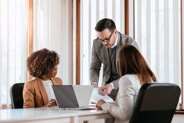 Businessman searching documentation on the meeting